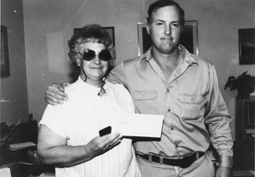 Shirley Ann Lofthouse with Andre Douchane, general manager of the Round Mountain Gold Corporation operations: photographic print