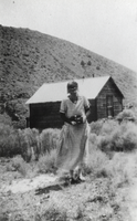 Unidentified woman in a cabin possibly around the Black Jack Mine: photographic print