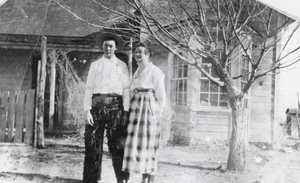 Kate Logan and her brother Roy pictured in front of a house on the Berg Ranch, Nevada: photographic print