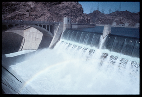 Water flows over the Arizona spillway, looking south-southwest at Hoover Dam, Arizona: photographic slide