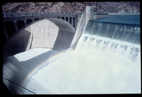 Water flows over the Arizona spillway, looking south-southwest at Hoover Dam, Arizona: photographic slide