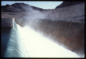 Water flows over the Arizona spillway, looking north at Hoover Dam, Arizona: photographic slide
