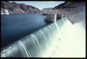 Water flows over the Arizona spillway, looking north-northwest at Hoover Dam, Arizona: photographic slide