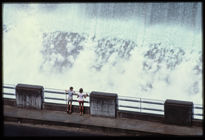 Children watch the overflow water in the Arizona spillway, looking west at Hoover Dam, Arizona: photographic slide