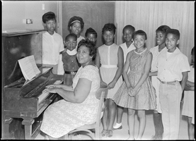 Set of photographs including NAACP event at Rubin's, piano class, and President Johnson in Las Vegas (October 11, 1964): image 001