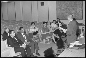 Set of photographs including Womens Domo West banquet, Reverend Walker, self-portrait experiment in mirror, Donald Powell in casket, school board, and press conference: image 001