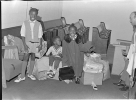 Set of photographs including Elder Jefferson, Gloria Brown, and Hicks family at Victory Church: image 001
