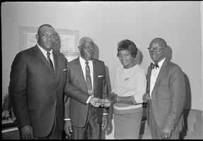 Set of photographs including Progressive Men's Club presents Mrs. Hicks with money, and J. Elliot at Sam Krug: image 001