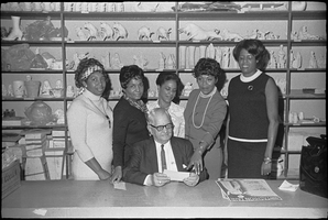 Set of photographs including Gama Rho Chapter for fashion show publicity, Sugar Hill football team for McDaniel, Les Femmes Douze, Joann Pughsley, Ruth Hicks' son, Employees at Sight & Sound, and Beautician at Continental: image 001