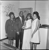 Set of photographs including Sarann fashion show, and copy negative of serviceman: image 001