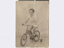 Photograph of Maurice Behar a bicycle, August 24, 1942