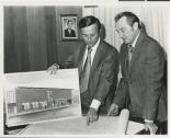 Lloyd Katz and unknown man with rendering and blue prints for Cinemas 1, 2, 3, 1960s
