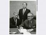 Stuart Mason, Morry Mason, and Fred Bennioger meeting to sign a contract for the International Hotel, circa 1969