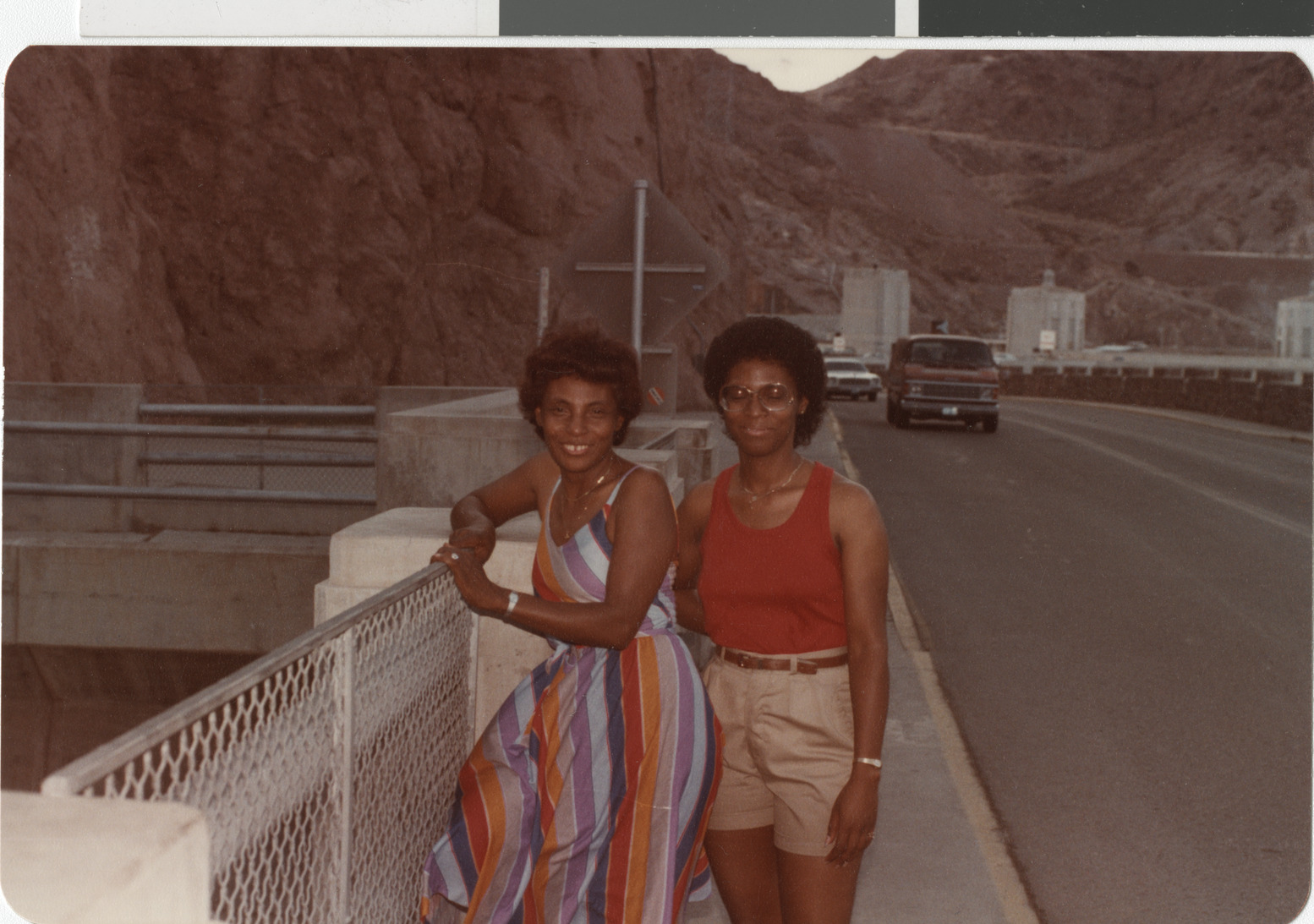 Color photograph of Ruby (left) and Gwen at Hoover Dam, 1980s
