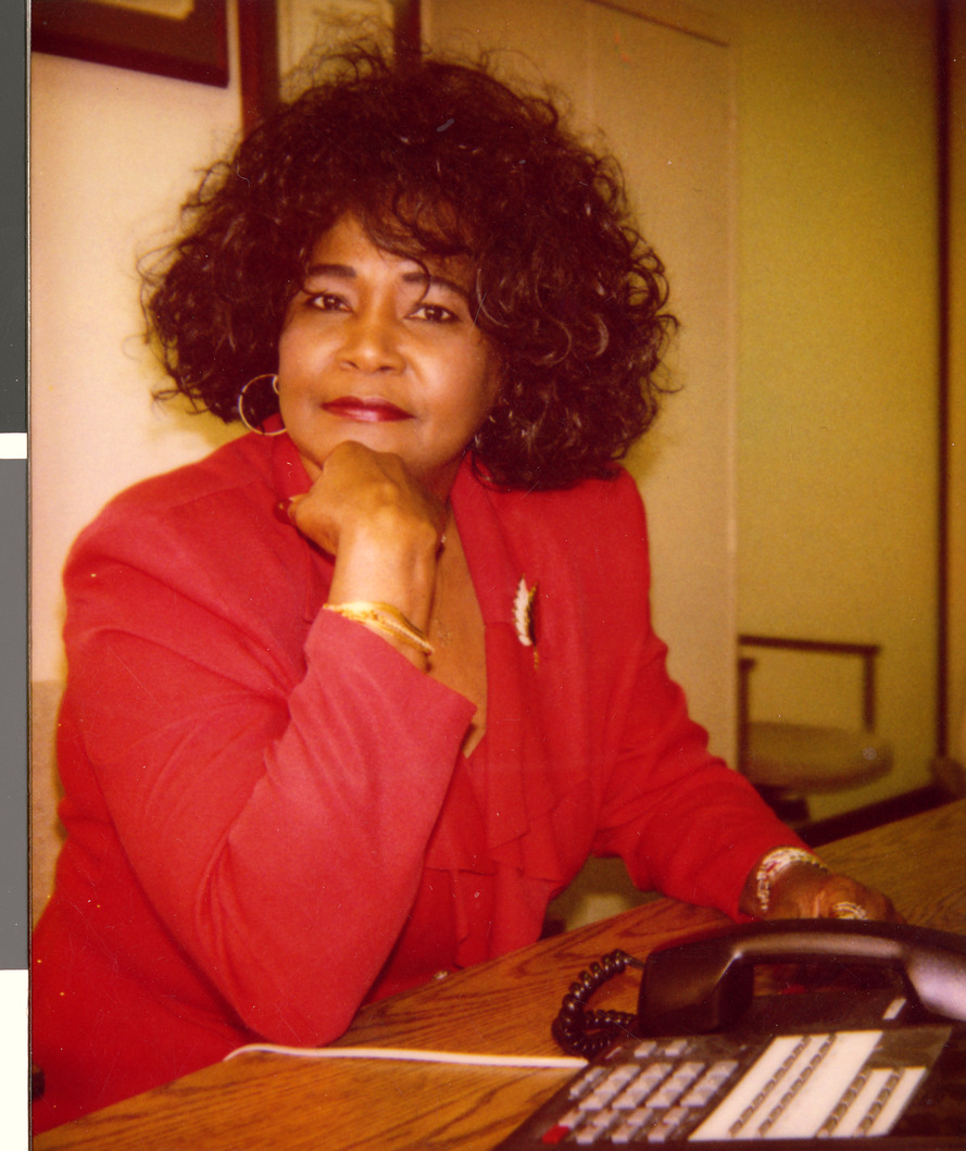 Marzette Lewis at her desk, Image 01