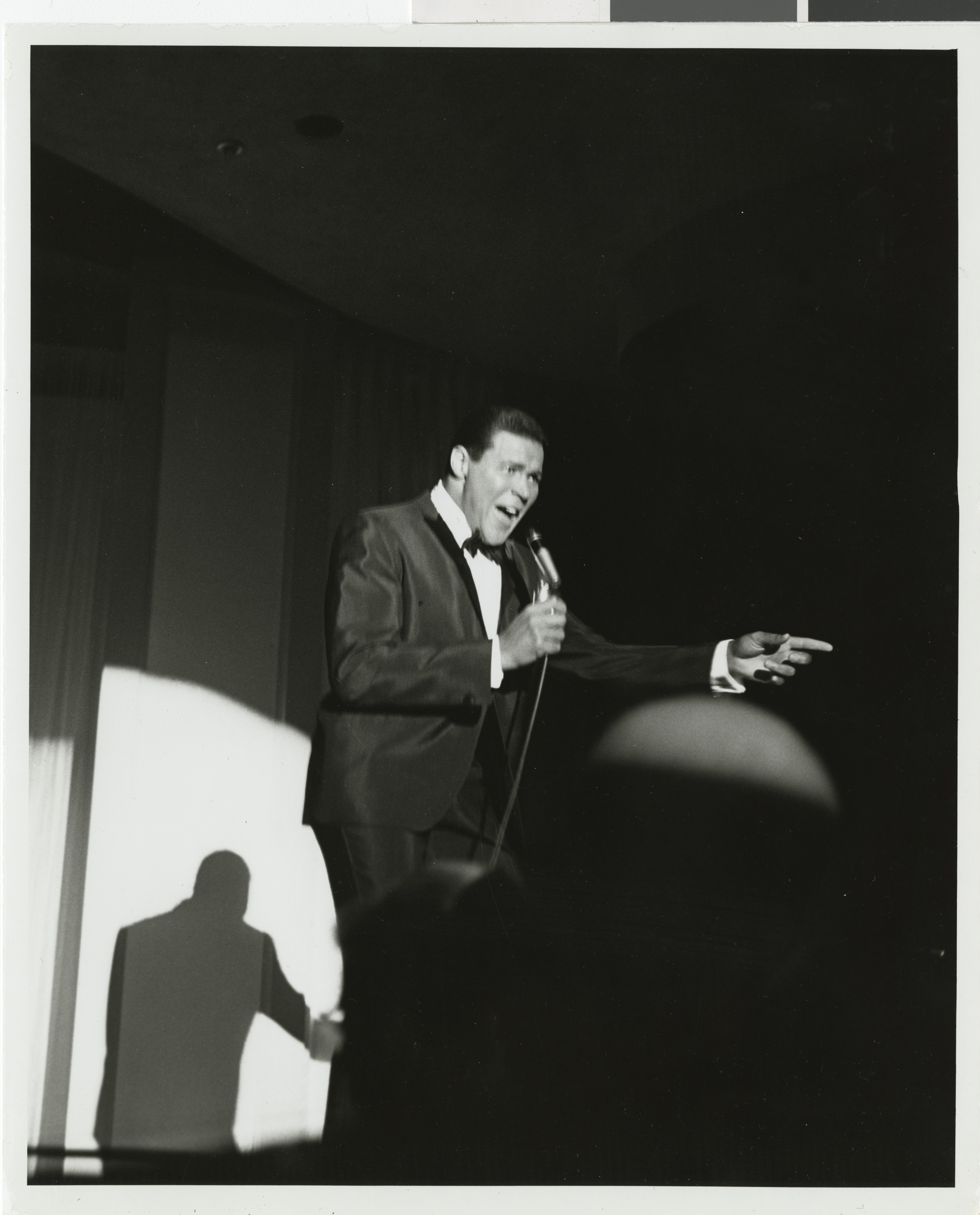 Photograph of Chubby Checker performing onstage at the Sands Hotel, August 1962