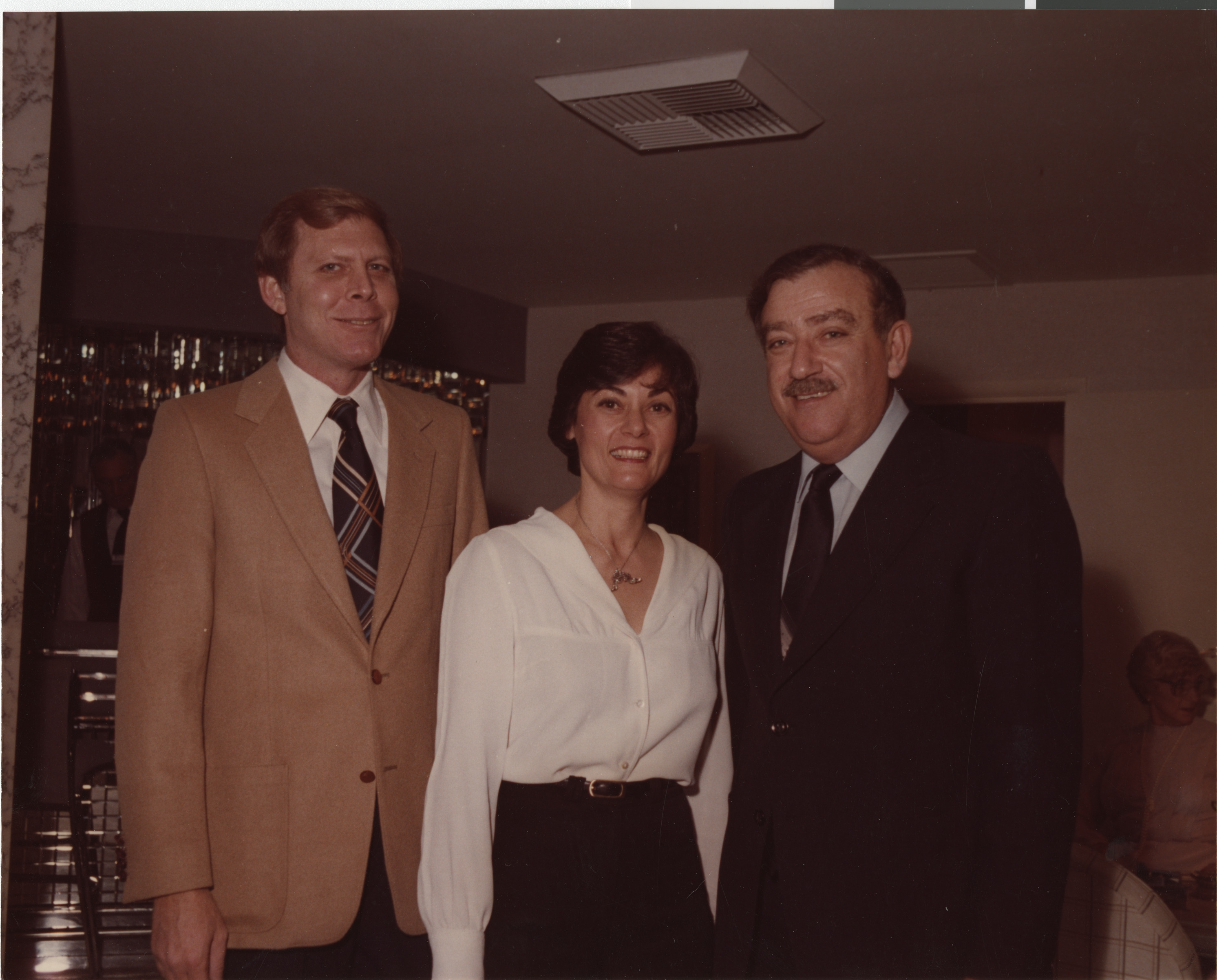 Photograph of Stuart and Flora Mason with Simcha Dinitz of Israel at the home of Art and Jayne Marshall, Fall 1981
