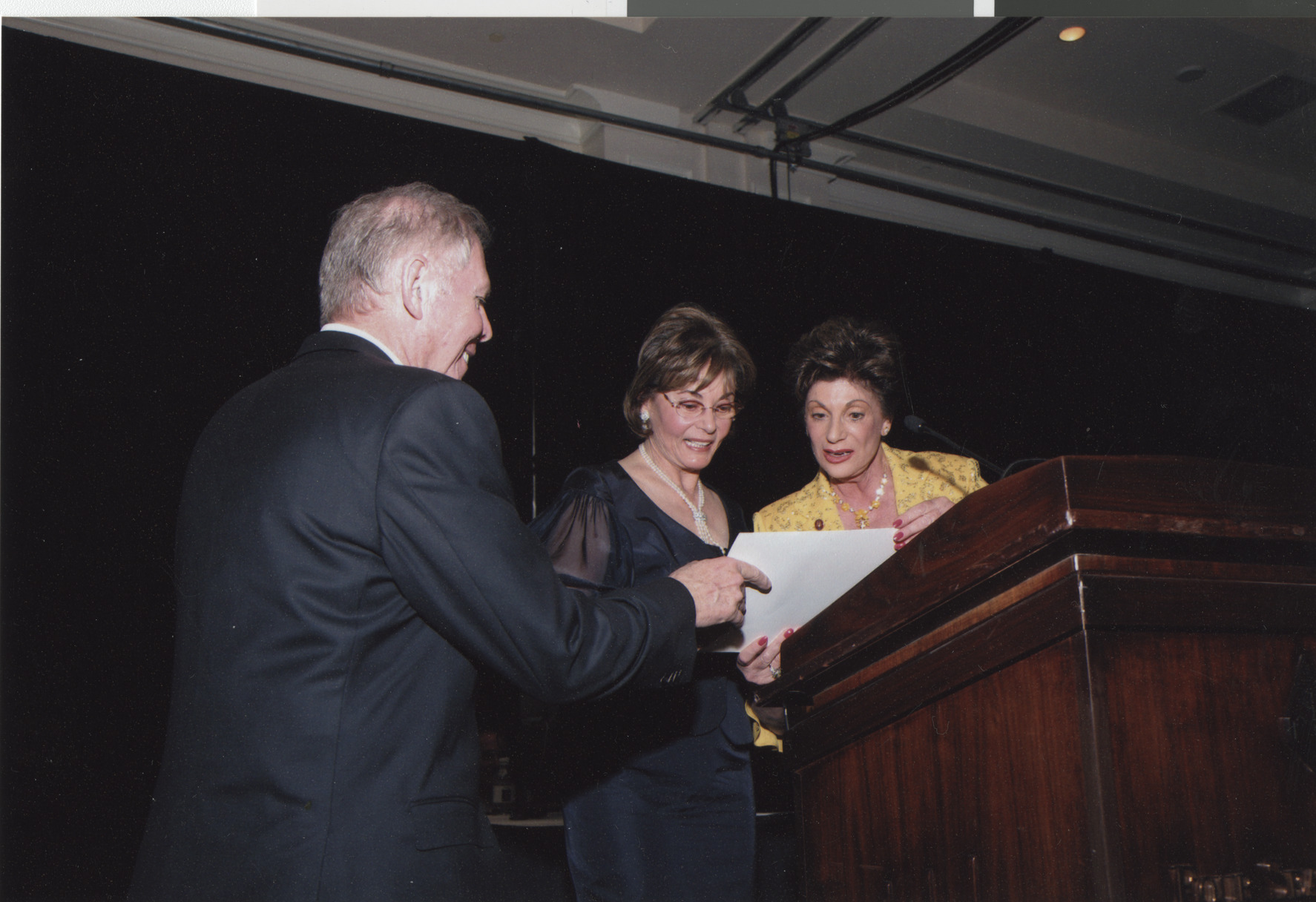 Photograph of Stuart and Flora Mason receiving a certificate from Shelley Berkley, April 2008