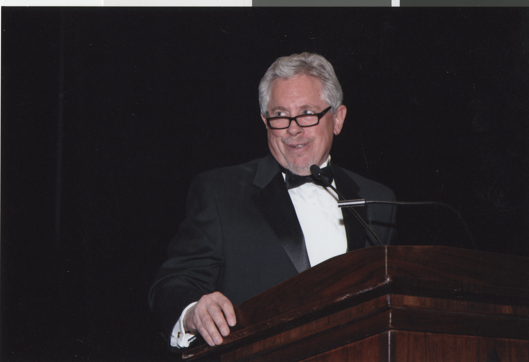 Photograph of a man at a podium, April 2008