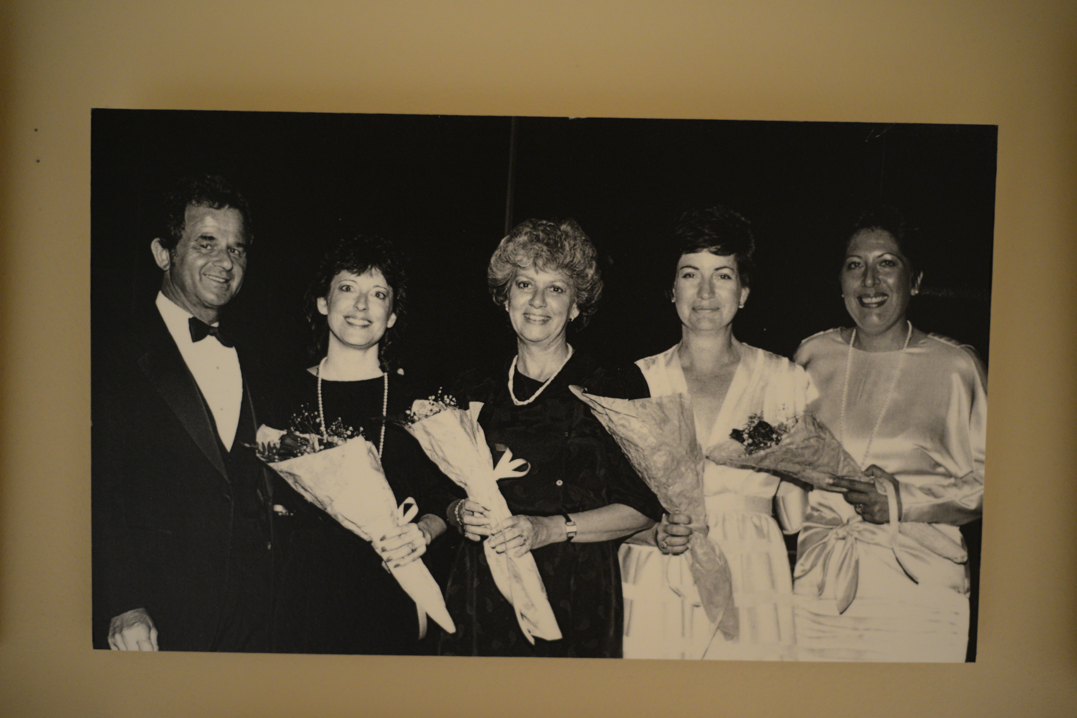 Photograph of a group of women, including Dorothy Eisenberg, holding bouquets of flowers, date unknown