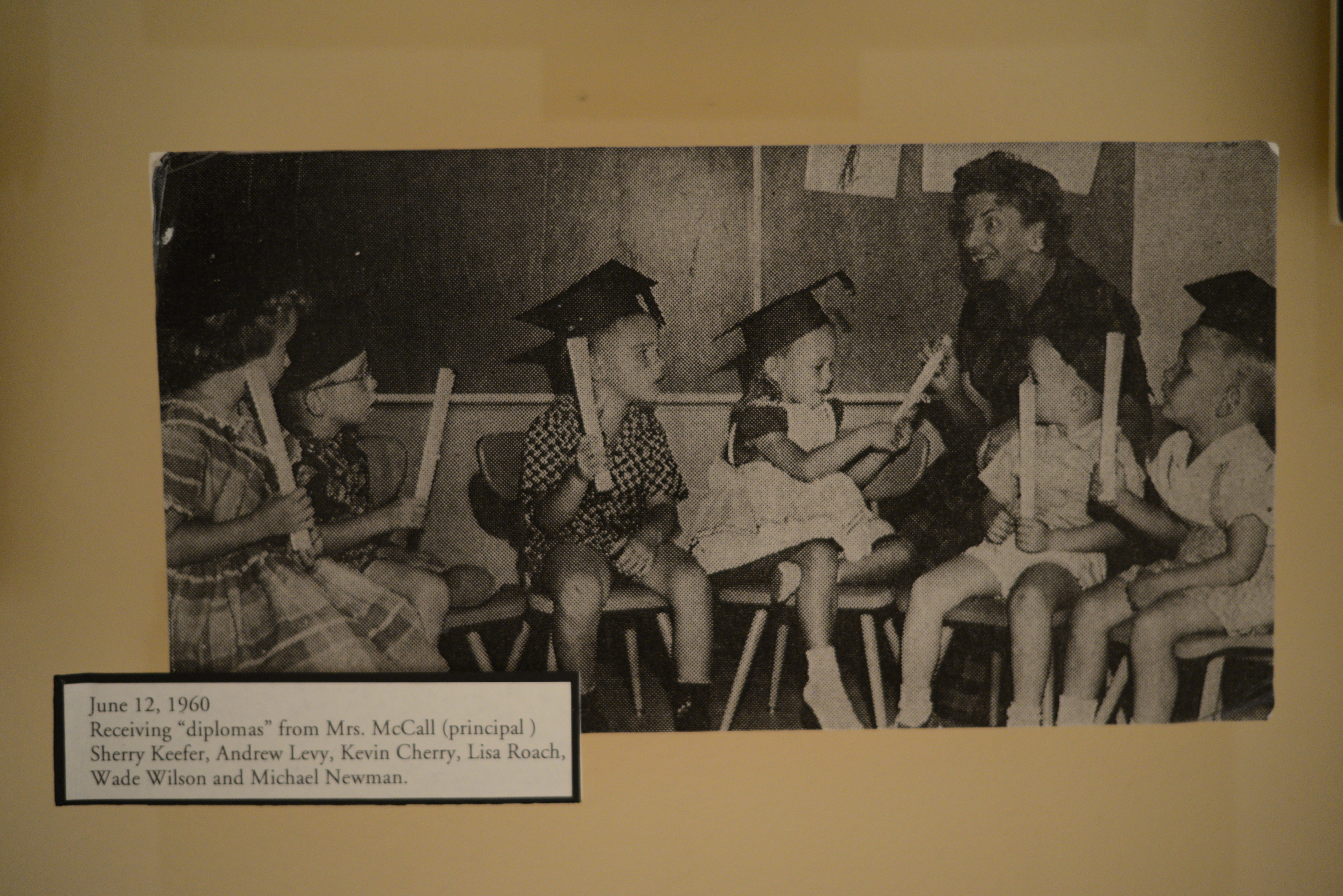 Photograph of children receiving diplomas, June 12, 1960