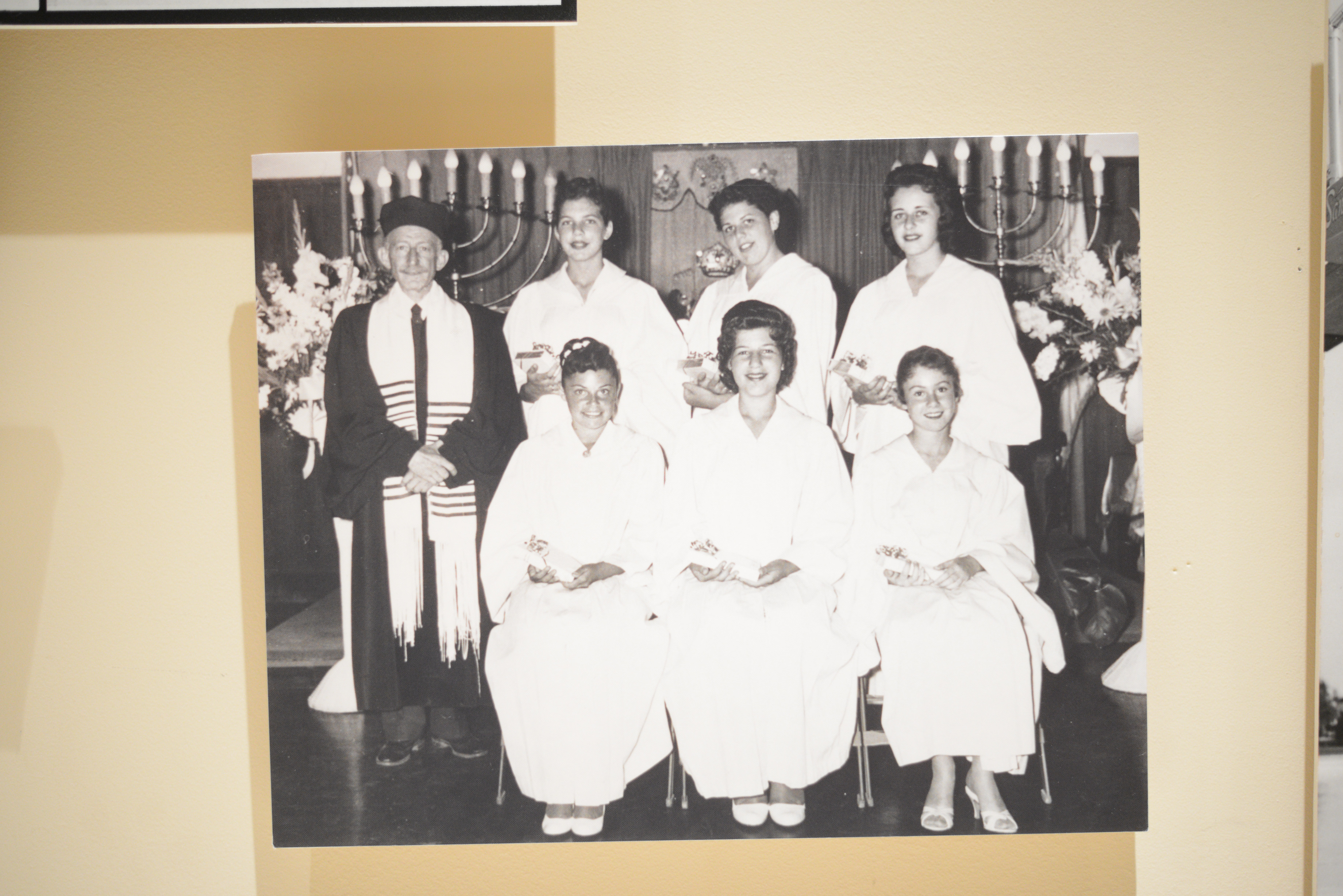 Photograph of a group of young women and rabbi