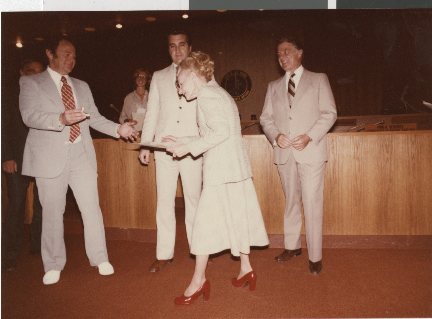 Photograph of Ron Lurie presenting certificate, circa 1978