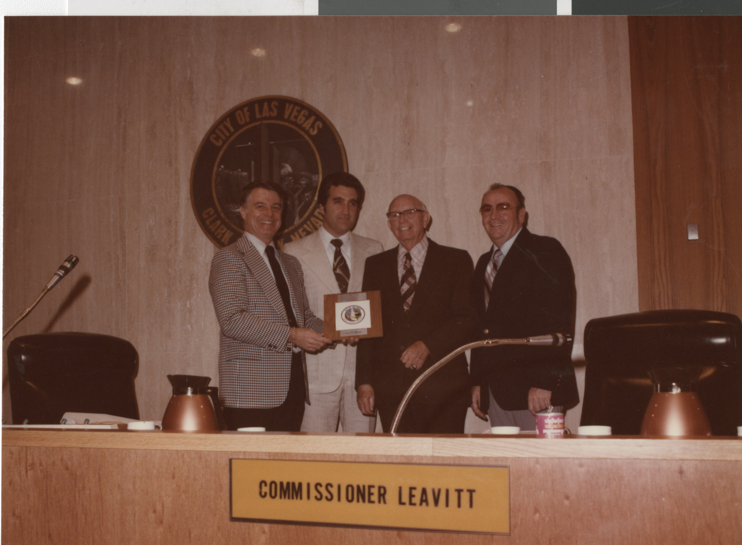 Photograph of Mayor Briare and Ron Lurie presenting plaque, circa 1978