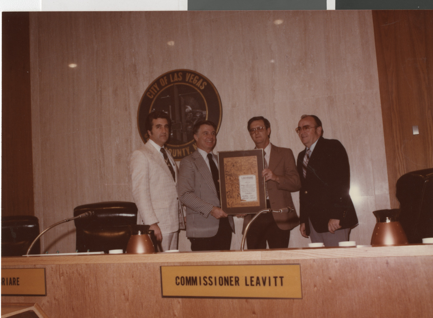 Photograph of Mayor Briare and Ron Lurie presenting plaque, circa 1978