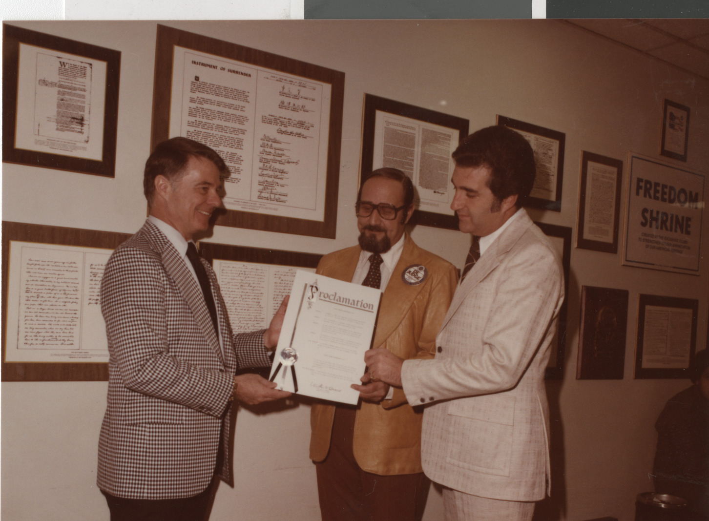 Photograph of Mayor Briare and Ron Lurie presenting a proclamation, circa 1978