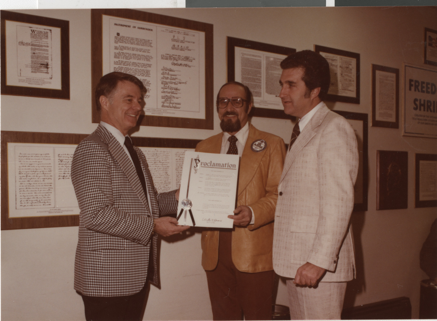 Photograph of Mayor Briare and Ron Lurie presenting a proclamation, circa 1978