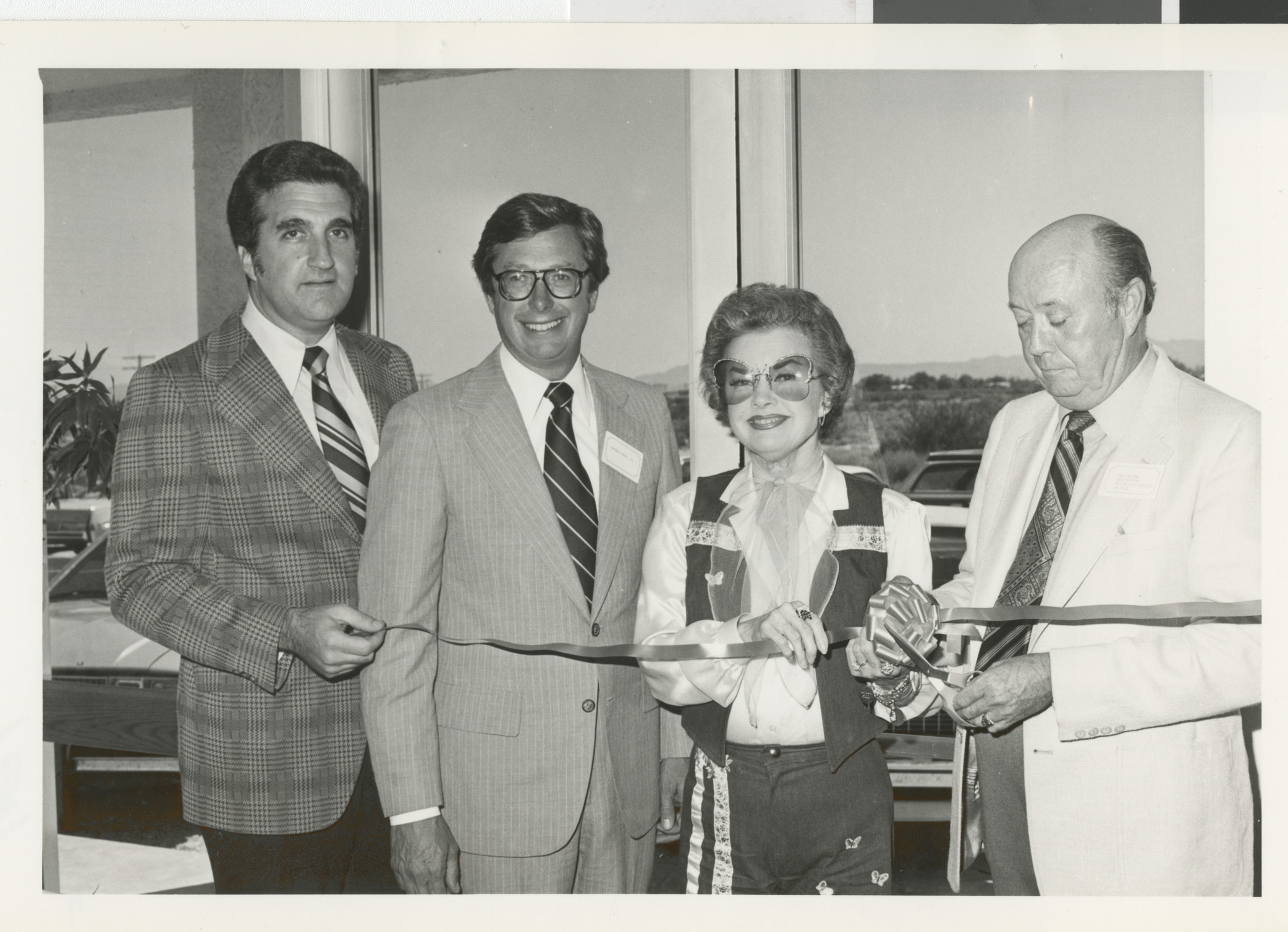 Photograph of Ron Lurie at a ribbon cutting with Bob List and two others, circa 1978