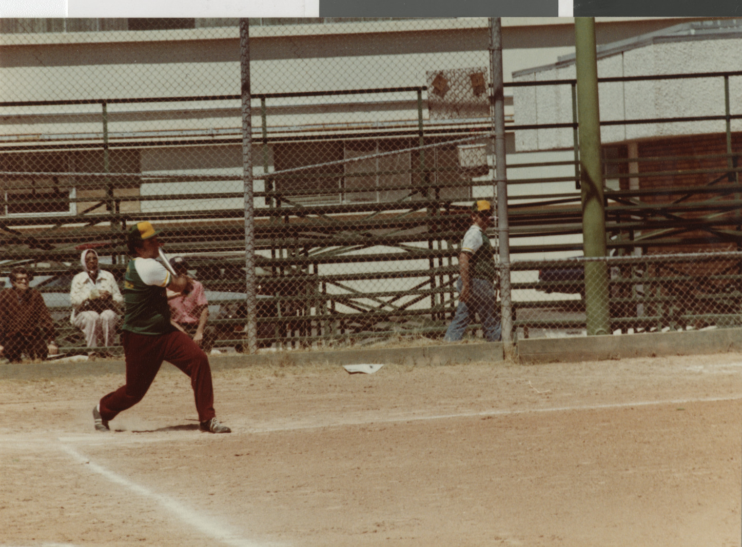 Photograph of Ron Lurie playing softball