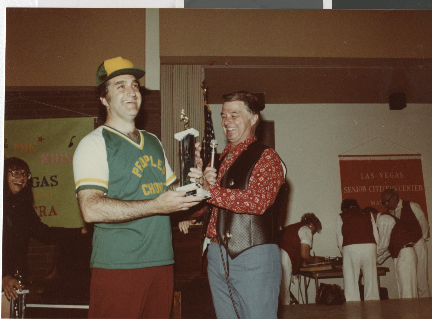 Photograph of Ron Lurie receiving a trophy