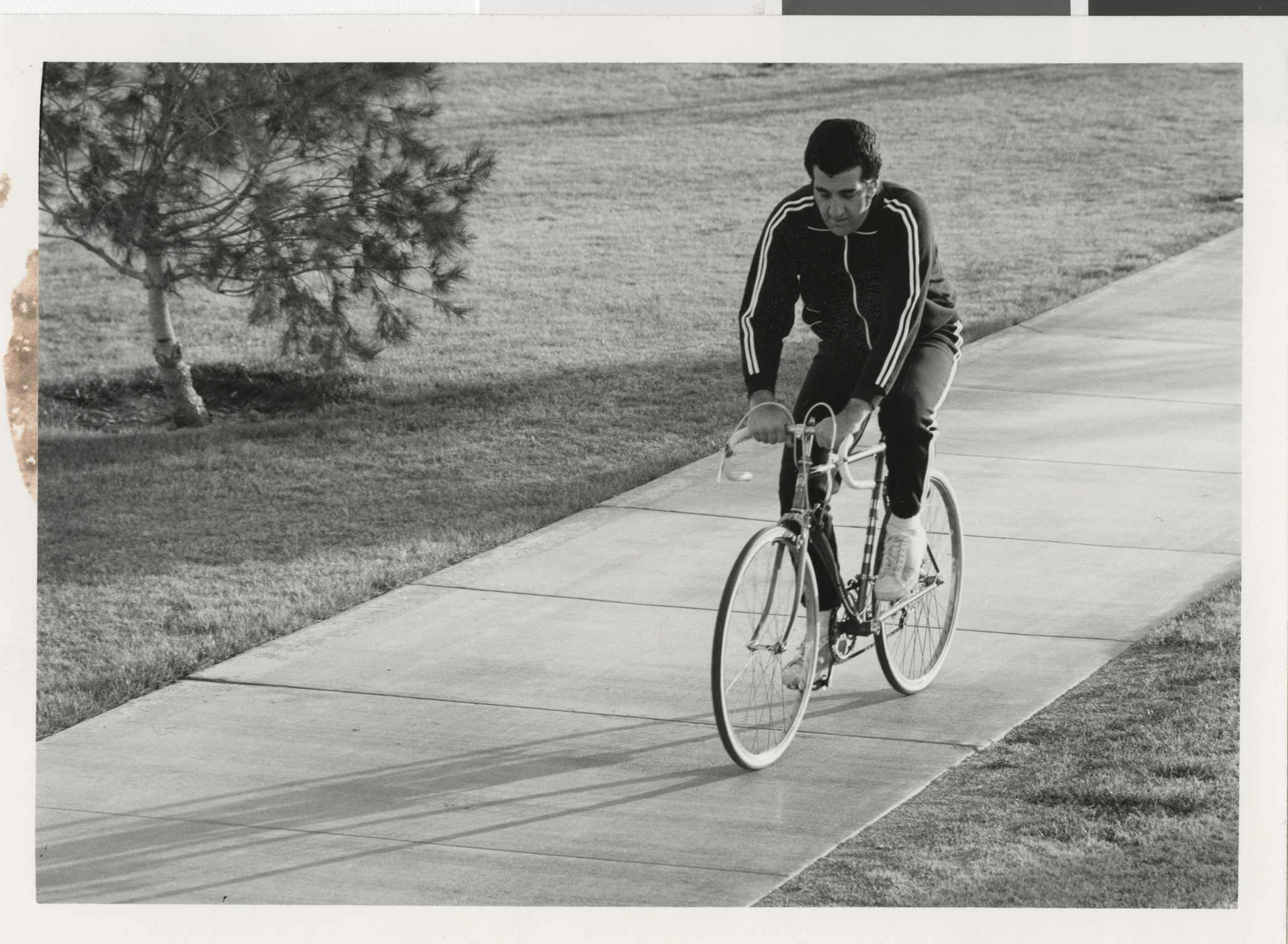 Photograph of Ron Lurie riding a bicycle