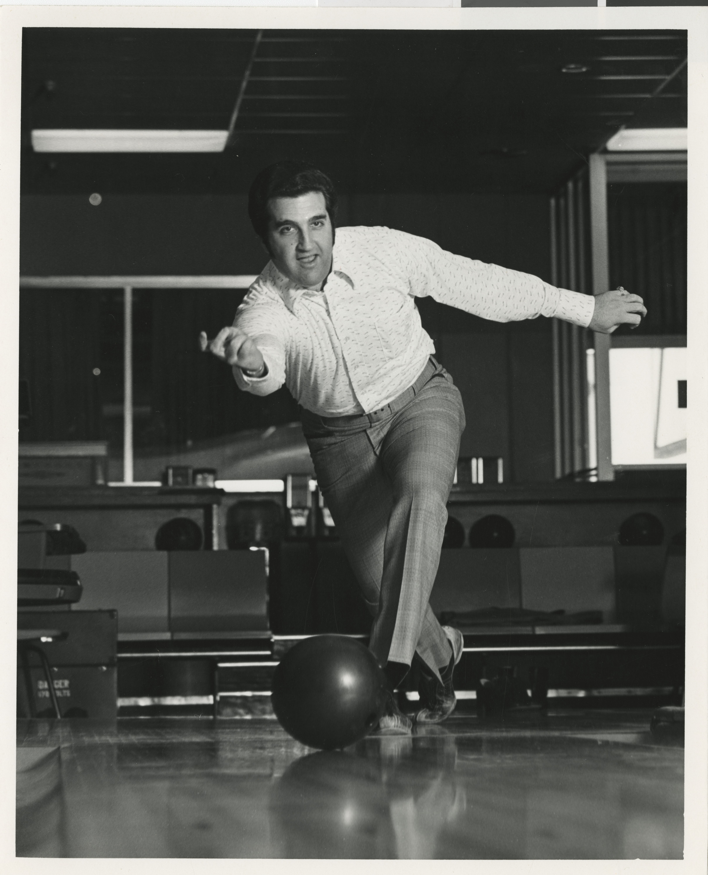 Photograph of Ron Lurie bowling