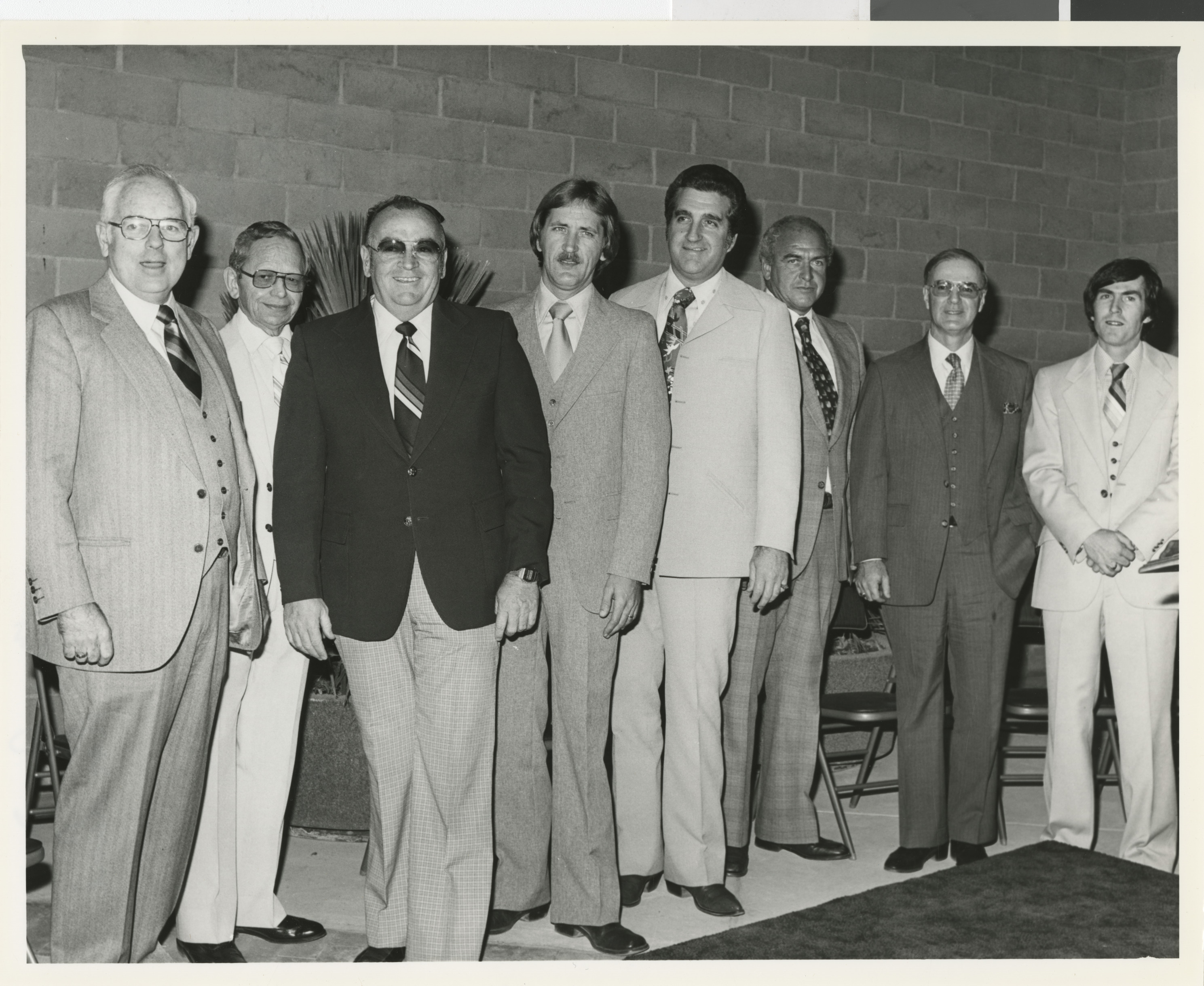 Photograph of Ron Lurie with a group of men