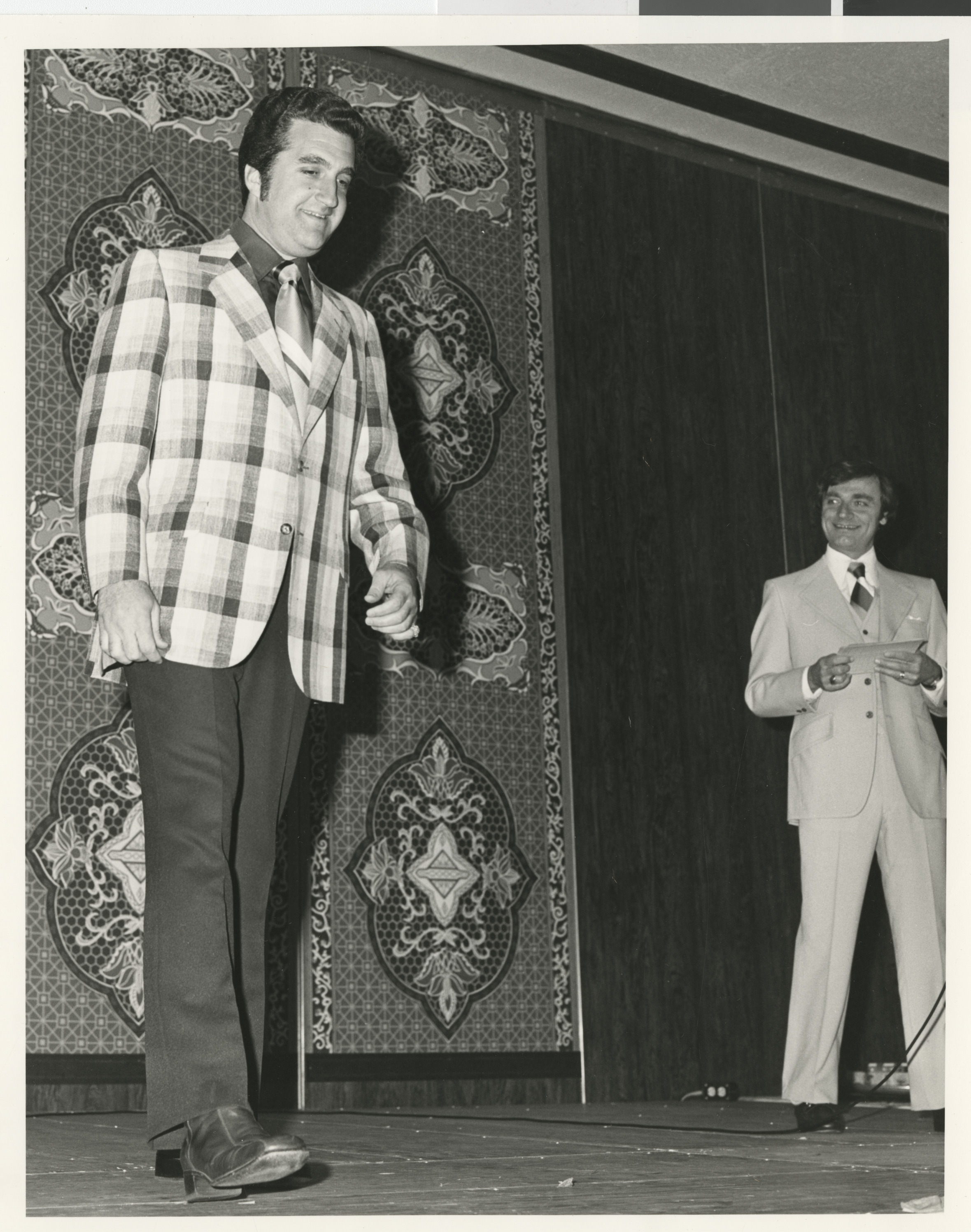 Photograph of Ron Lurie on stage at an event