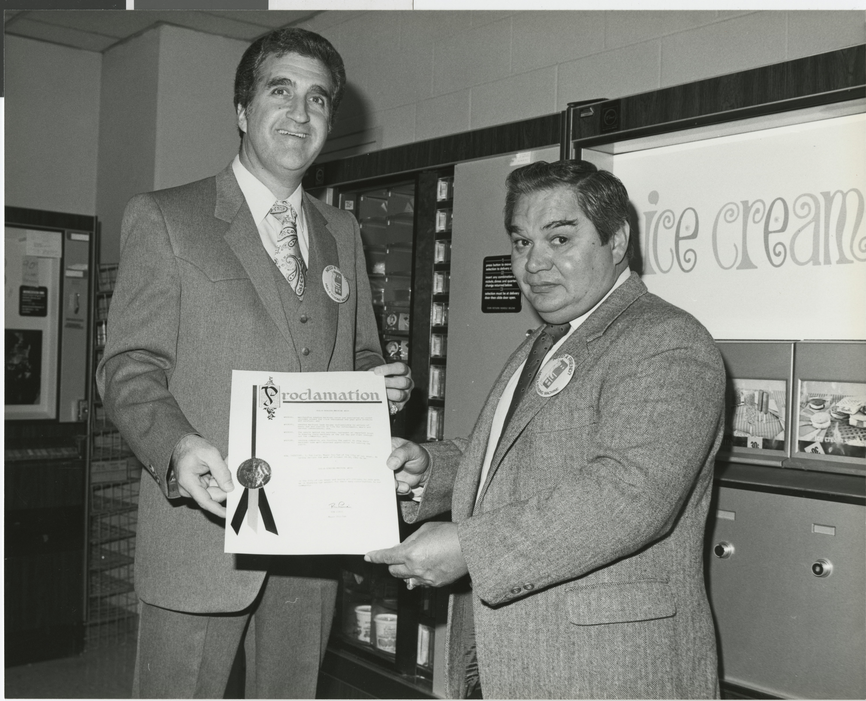 Photograph of Ron Lurie presenting a Proclamation to Raphael E. Vega, President of the Nevada Vending and Amusement Association, November 3, 1982
