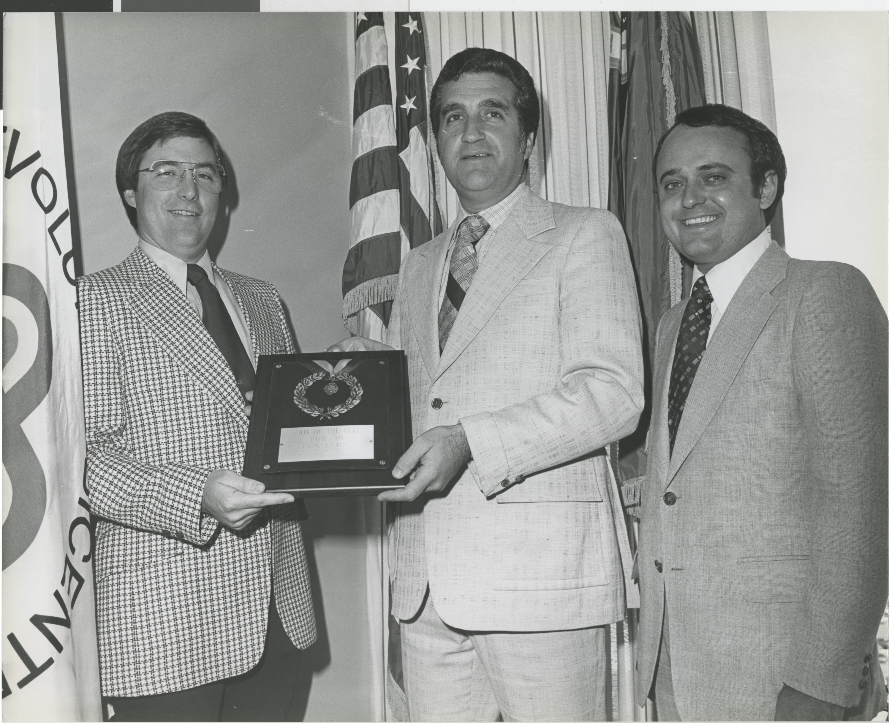 Photograph of Ron Lurie receiving Lion of the Year plaque, 1978-1979
