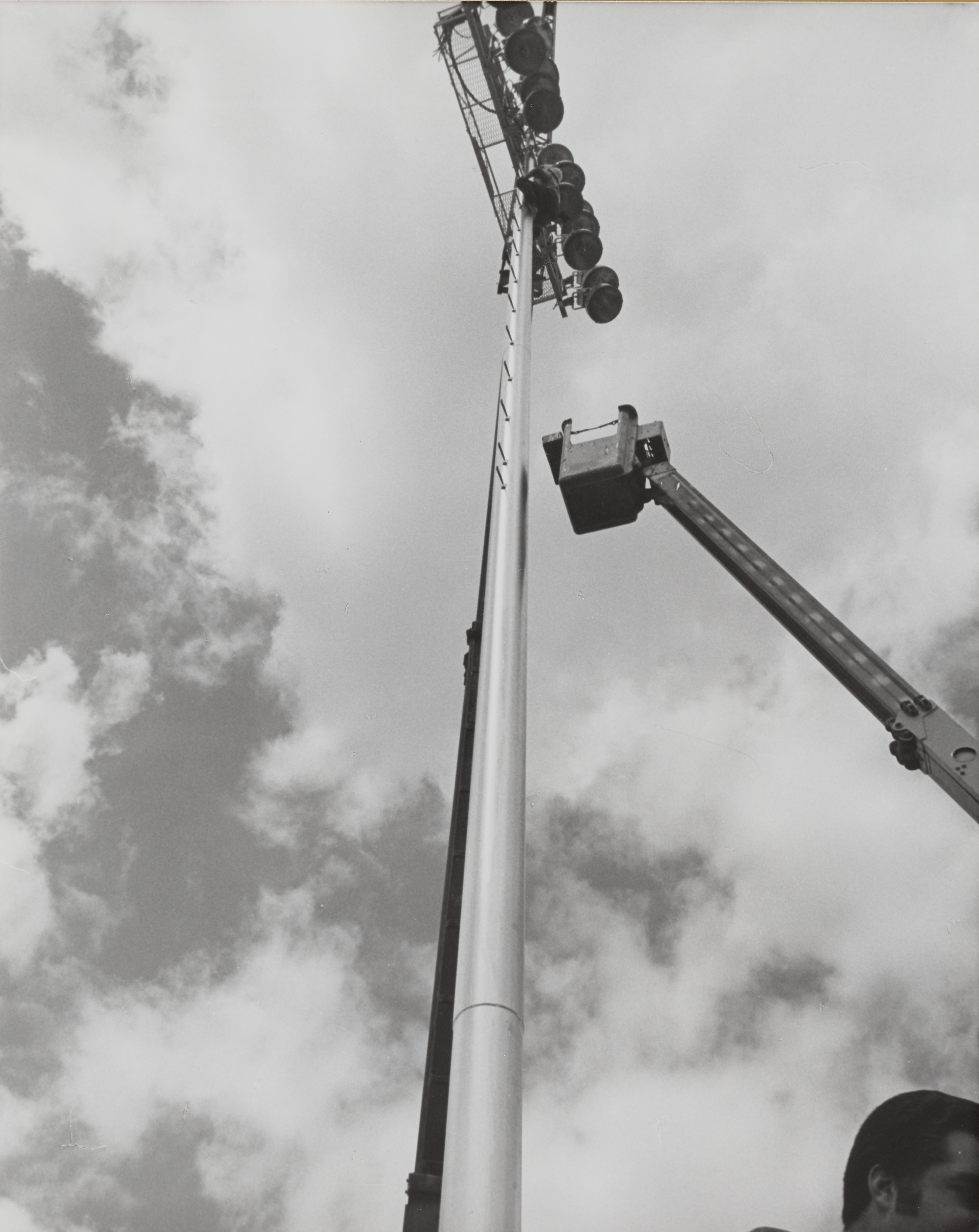 Photograph of utility pole (lights) and crane