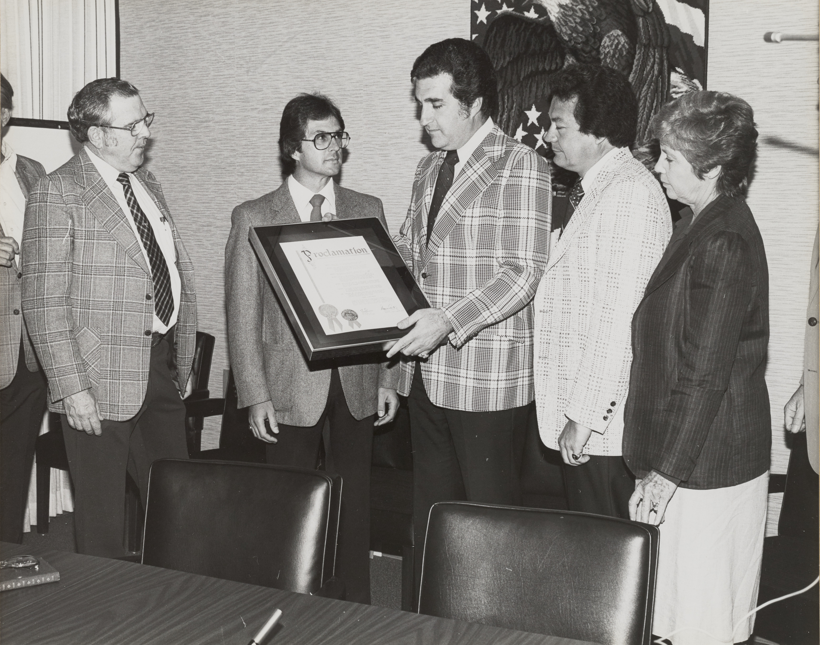 Photograph of Ron Lurie with a group giving Proclamation for Secret Witness, September 28, 1981