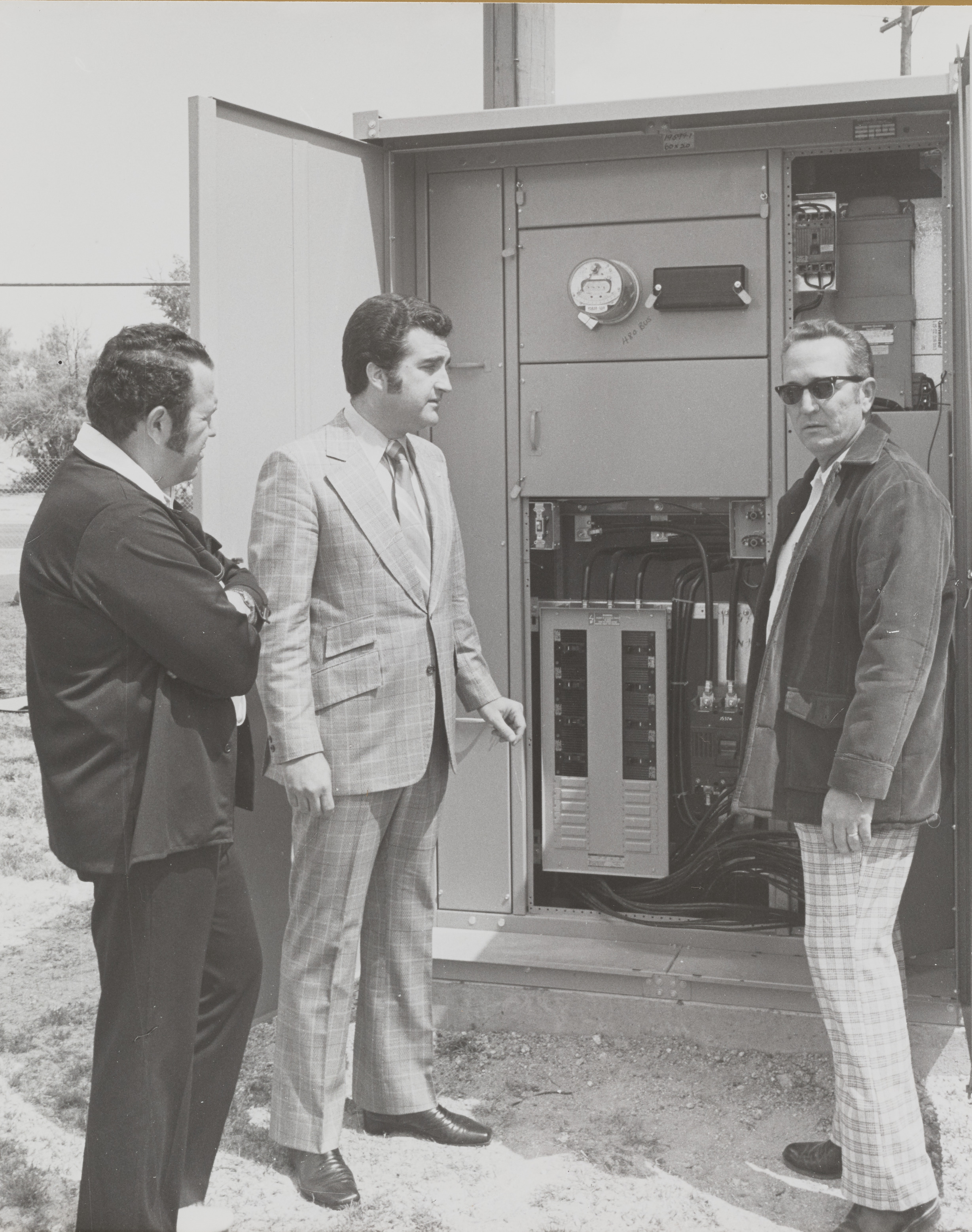 Photograph of Ron Lurie at junction box for utility pole