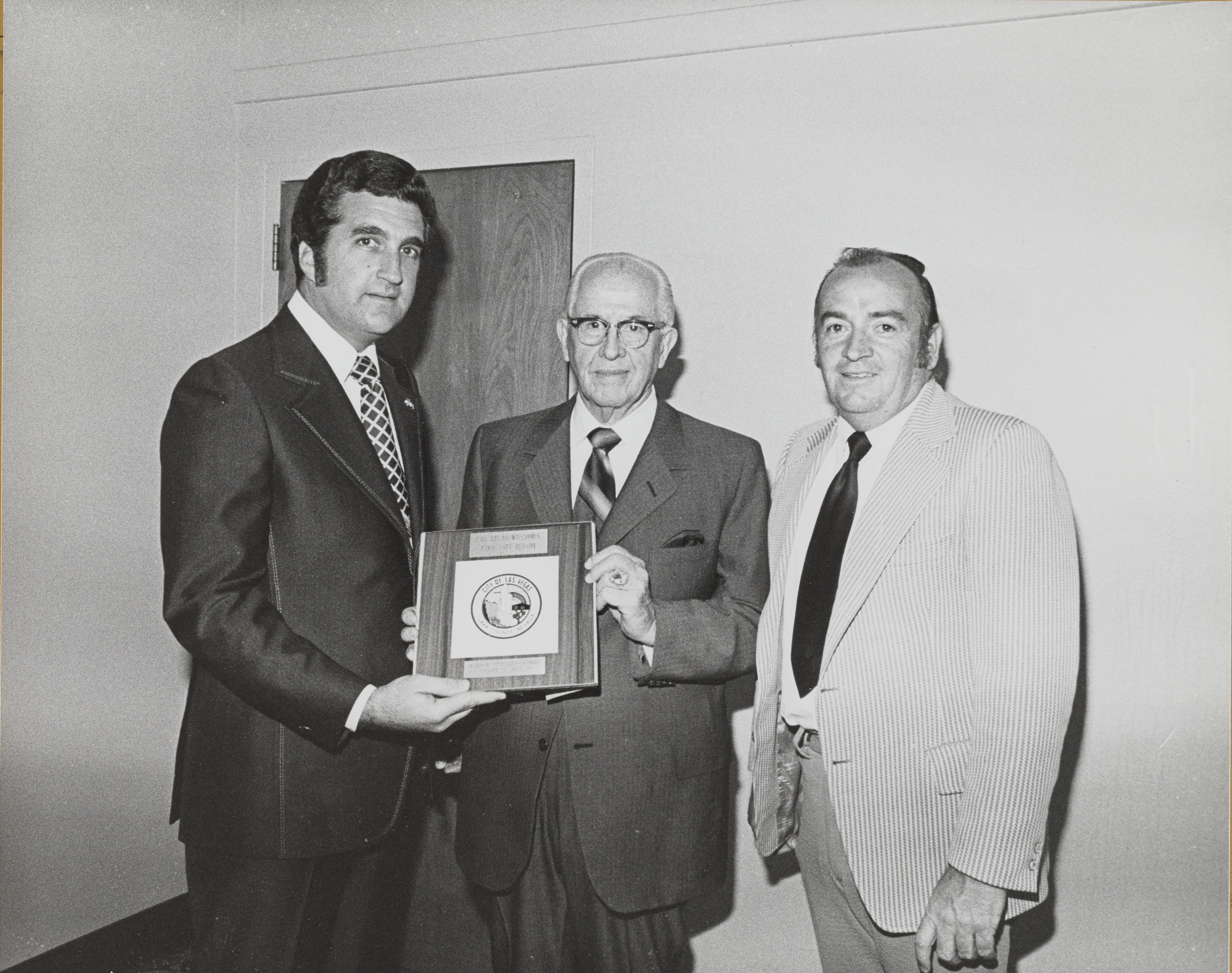 Photograph of Ron Lurie presenting plaque