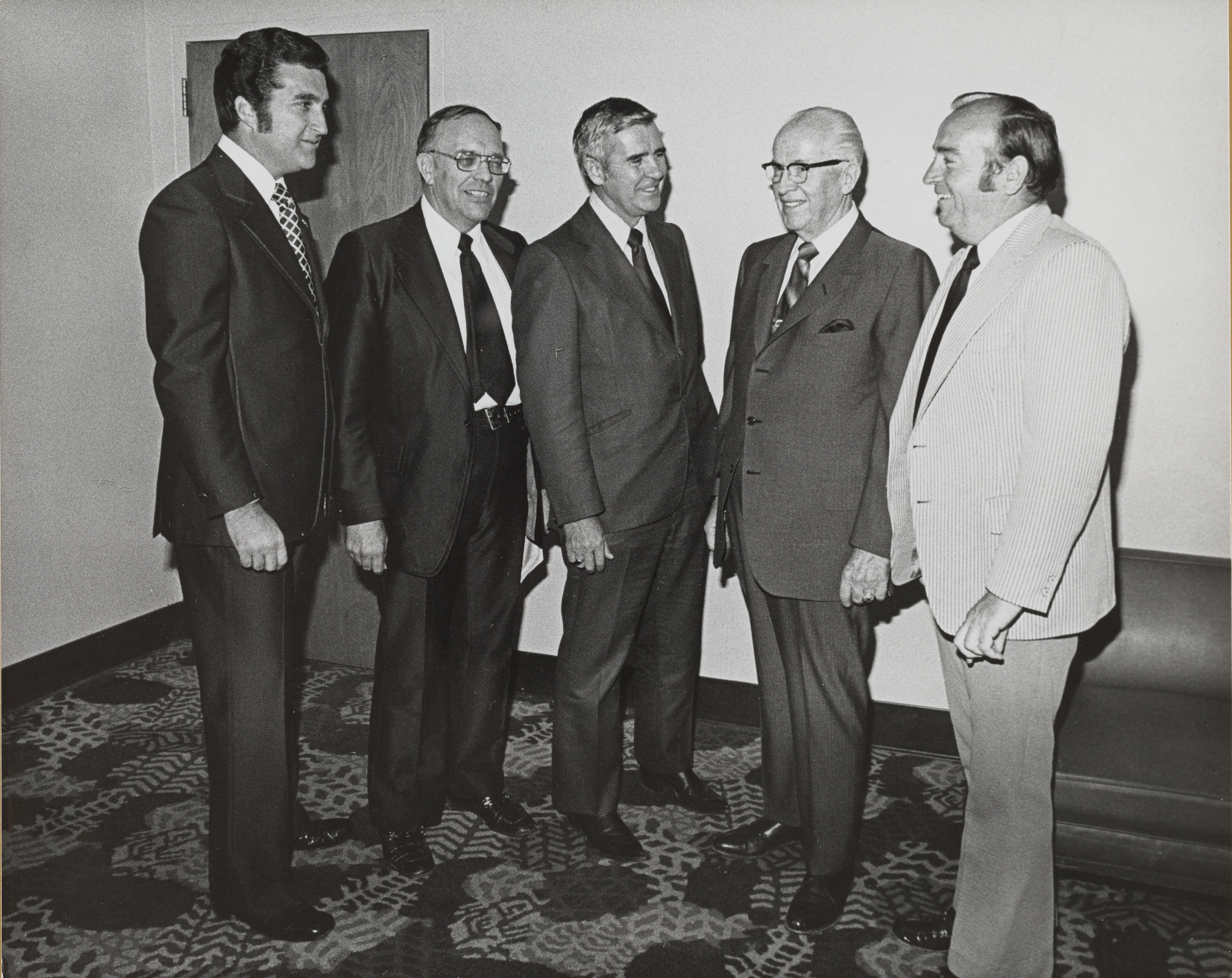 Photograph of Ron Lurie with group of men