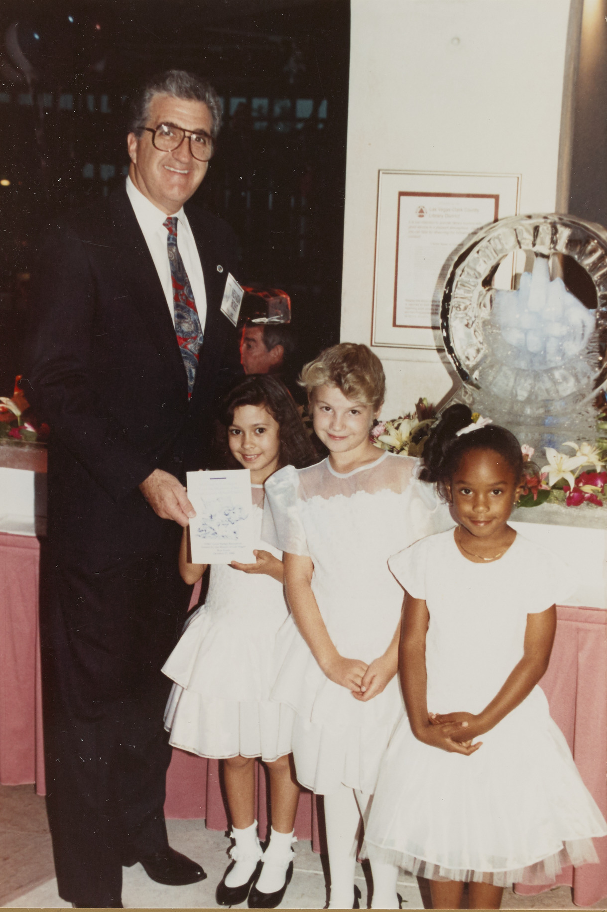 Photograph of Ron Lurie with children at the IDRC Reception at the Children's Museum and Library