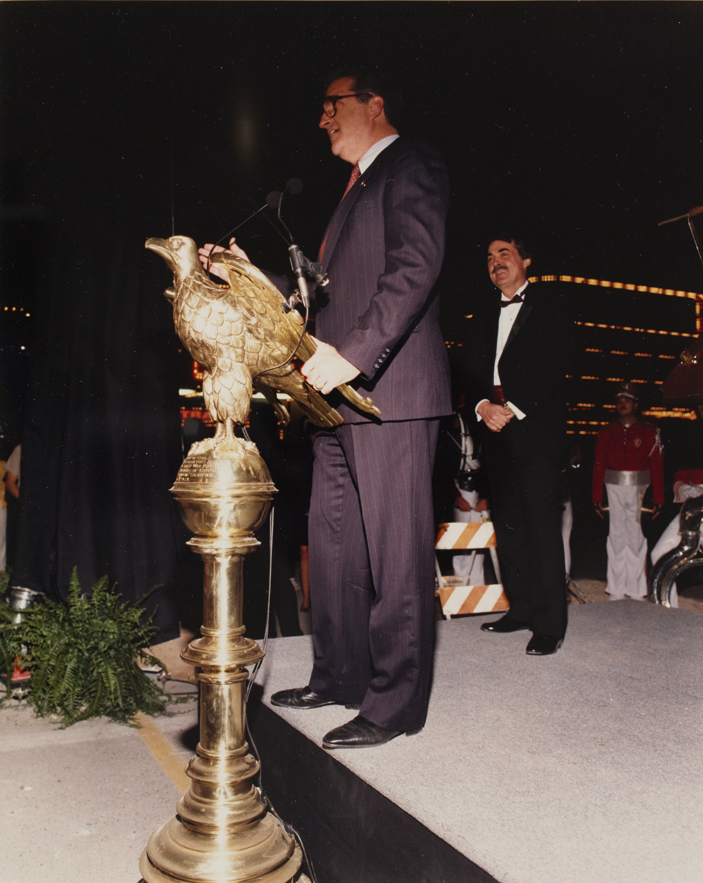 Photograph of Ron Lurie at eagle podium during ground breaking ceremony, 1990
