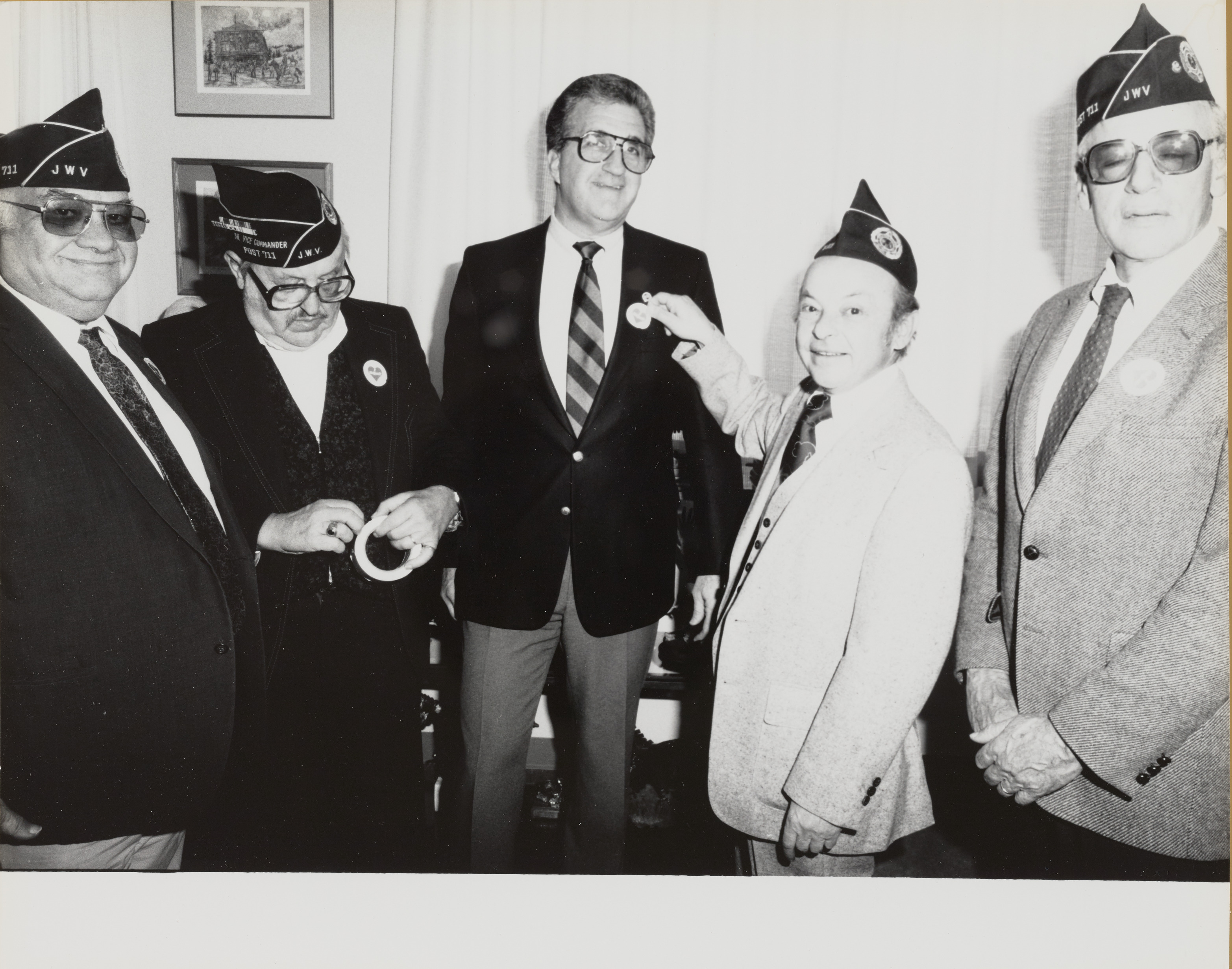 Photograph of Ron Lurie getting a pin from J.W.V. Post 11 (Jewish War Veterans), 1990