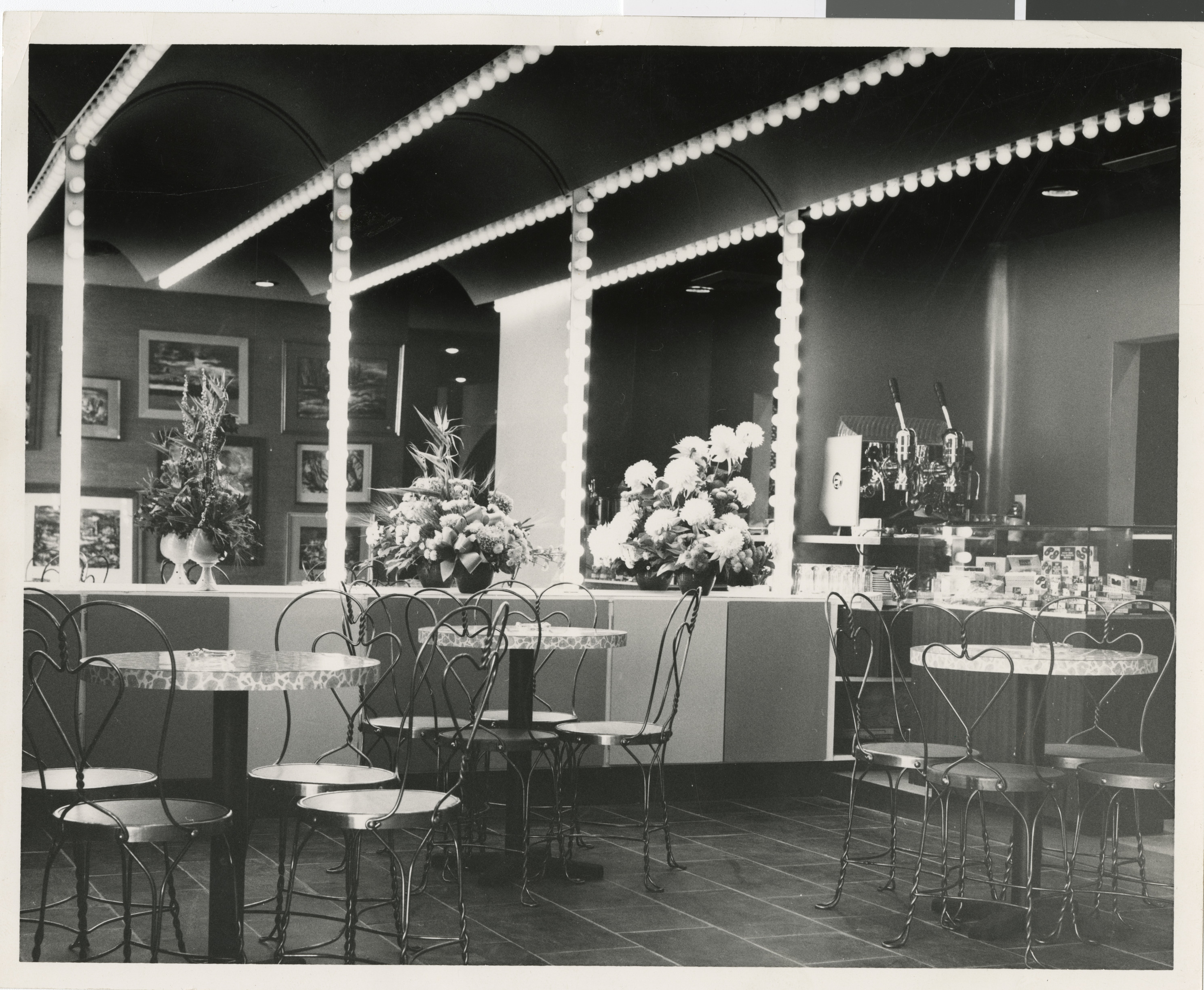 Photograph of interior of Guild Theater cafe tables