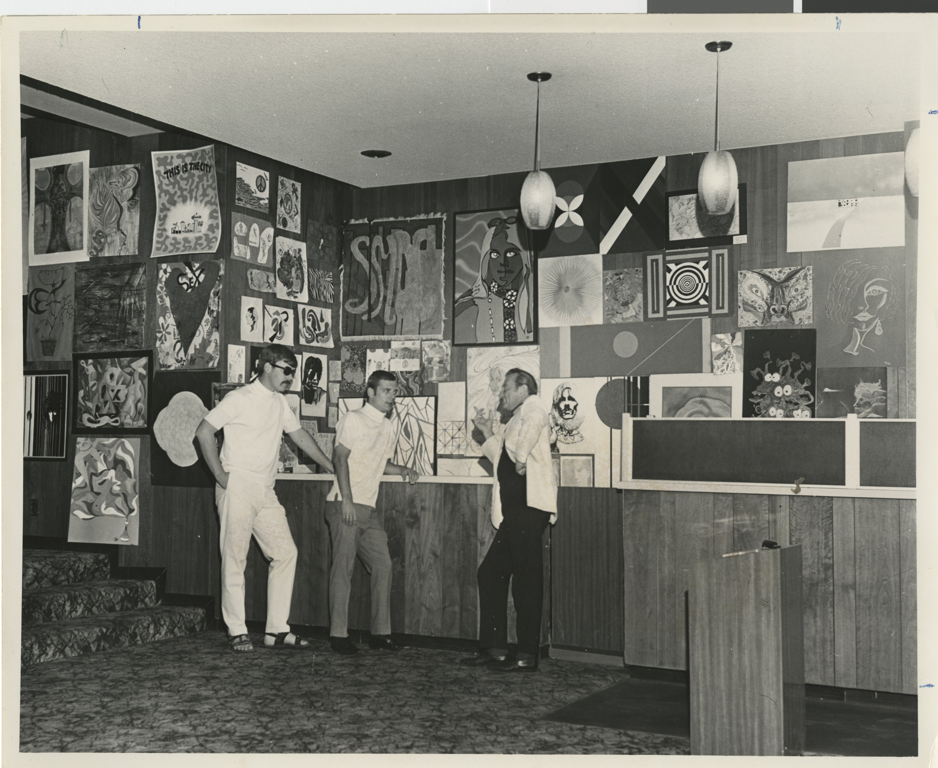 Photograph of interior lobby area of Huntridge Theater with art contest entries, 1968